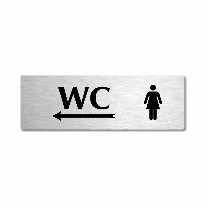 WC ženy vlevo, stříbrná popiska na dveře